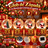 Glob de Zăpadă Premium de Crăciun cu Moș Crăciun, Bază tip Cutie Cadou cu Fundă Aurie, Muzică, Lumină LED și Efect de Ninsoare – 15 × 10 cm - imagine principala