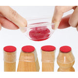 Set 8 Protectii Picioare Masa si Scaun Silicon Rotund 3-4cm Transparent/Rosu - detaliu produs